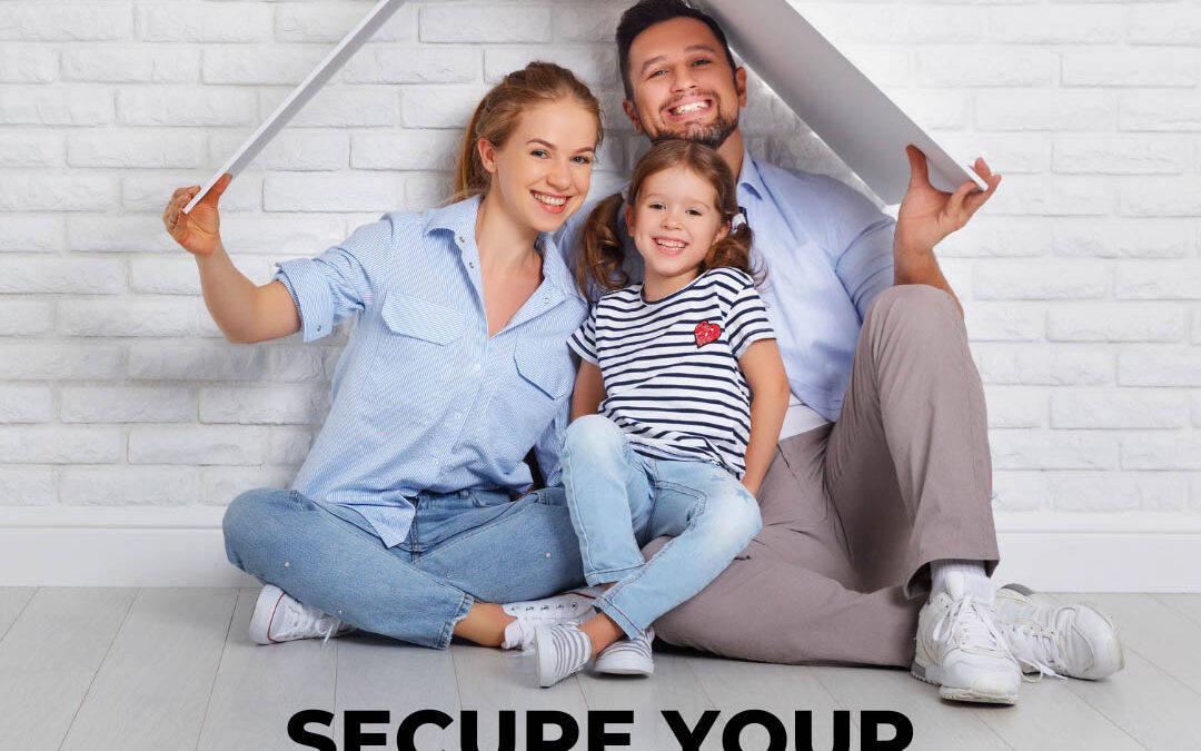 A smiling family of three sits on the floor holding a white, roof-shaped prop over their heads against a white brick wall. Below them, bold text reads, "SECURE YOUR FAMILY'S FUTURE!" - www.wattskennedy.com